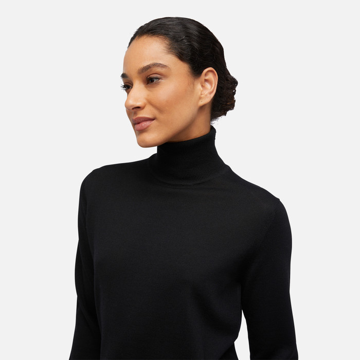 Jersey manga larga con cuello alto negro mujer